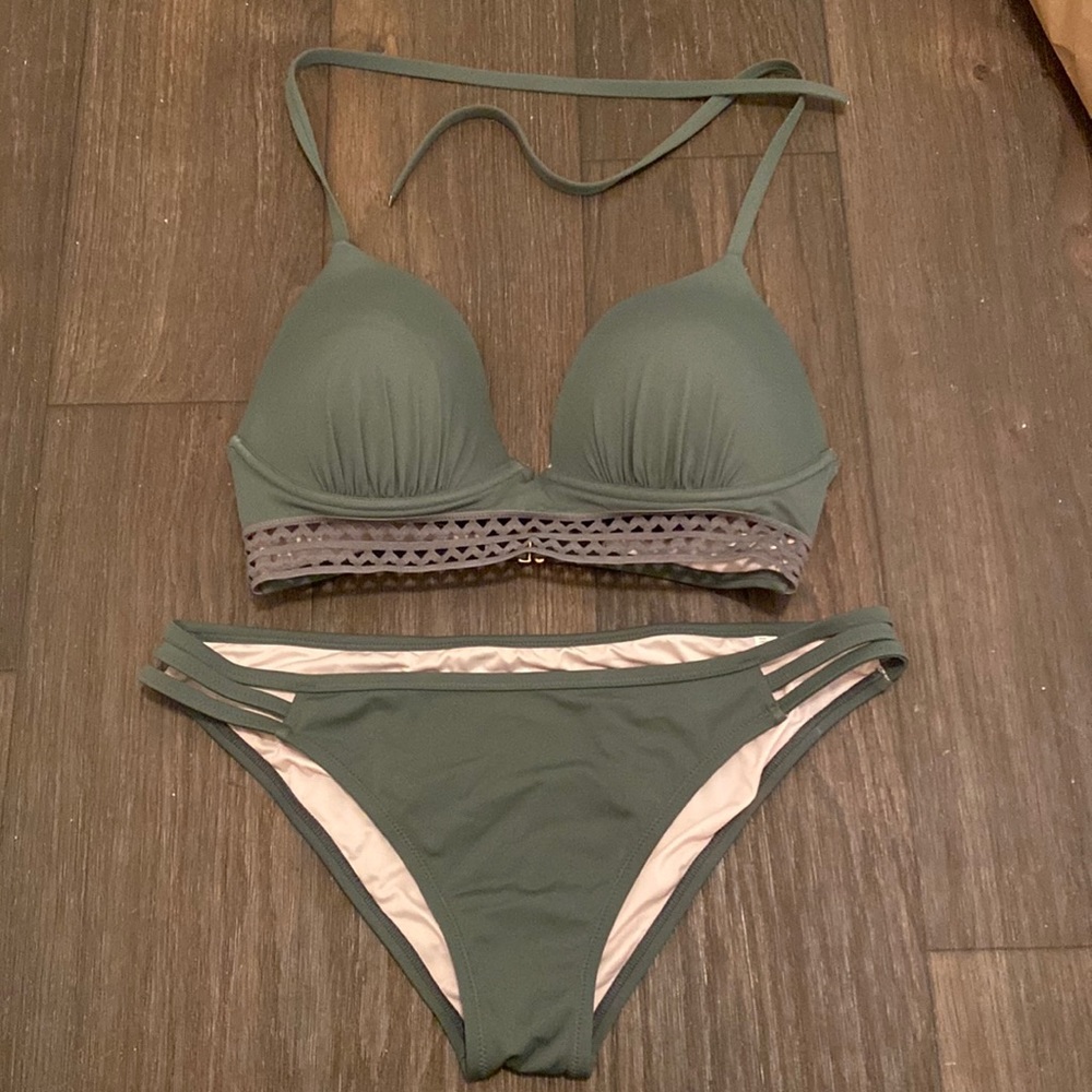 Adjustable halter bikini in olive with cutout rib band detail.